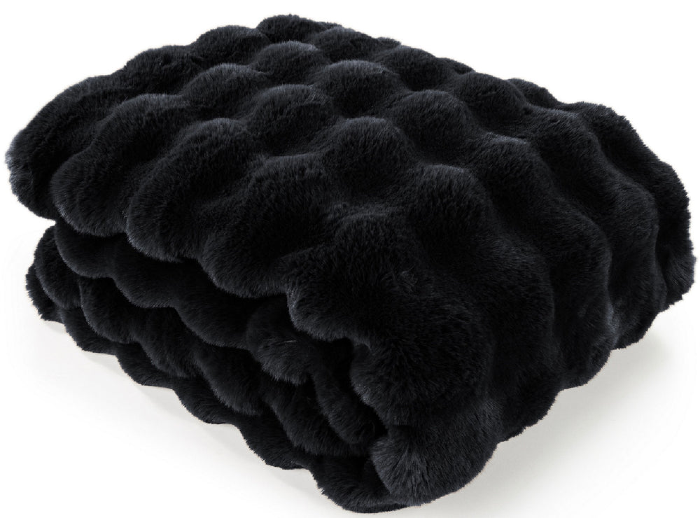 A folded black faux fur blanket with a wavy, tufted texture, shown on a clean white background.