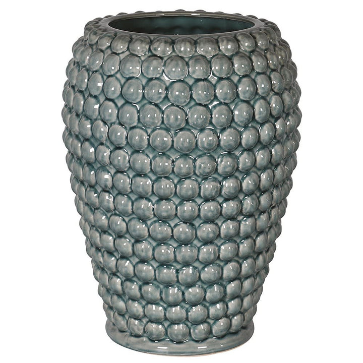 Teal textured vase on a white background