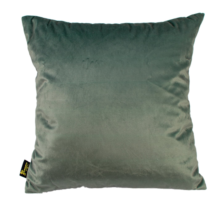 Green pillow with a brand tag on a white background