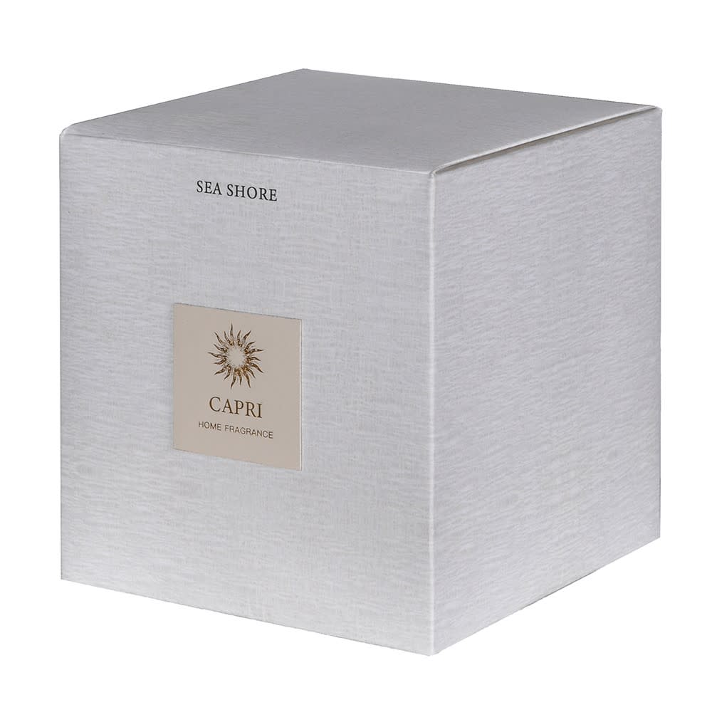 A square silver-gray textured box for CAPRI Home Fragrance, labeled &
