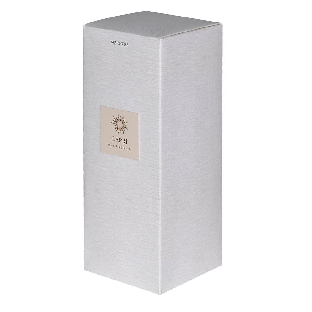 A tall, rectangular silver-gray home fragrance box with a textured finish, featuring a beige square label on the front that reads &