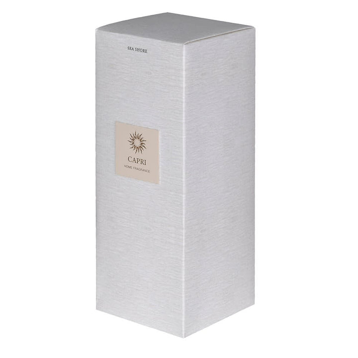A tall, rectangular silver-gray home fragrance box with a textured finish, featuring a beige square label on the front that reads &