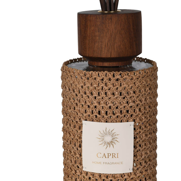 Capri home fragrance with wooden top and textured brown base on a white background