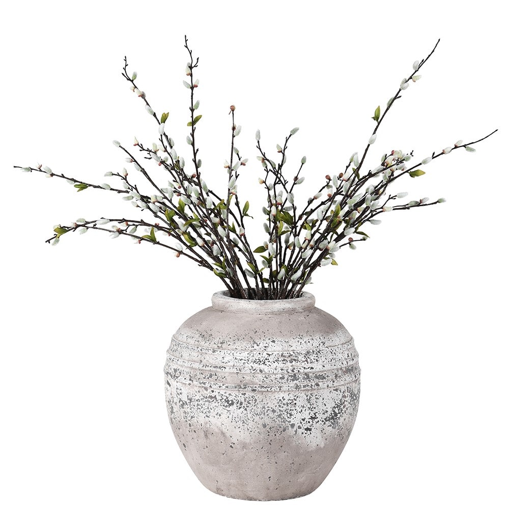 Decorative vase with branches on a white background