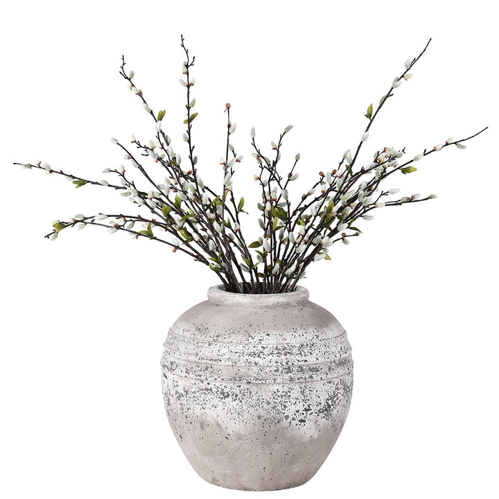 Decorative vase with branches on a white background
