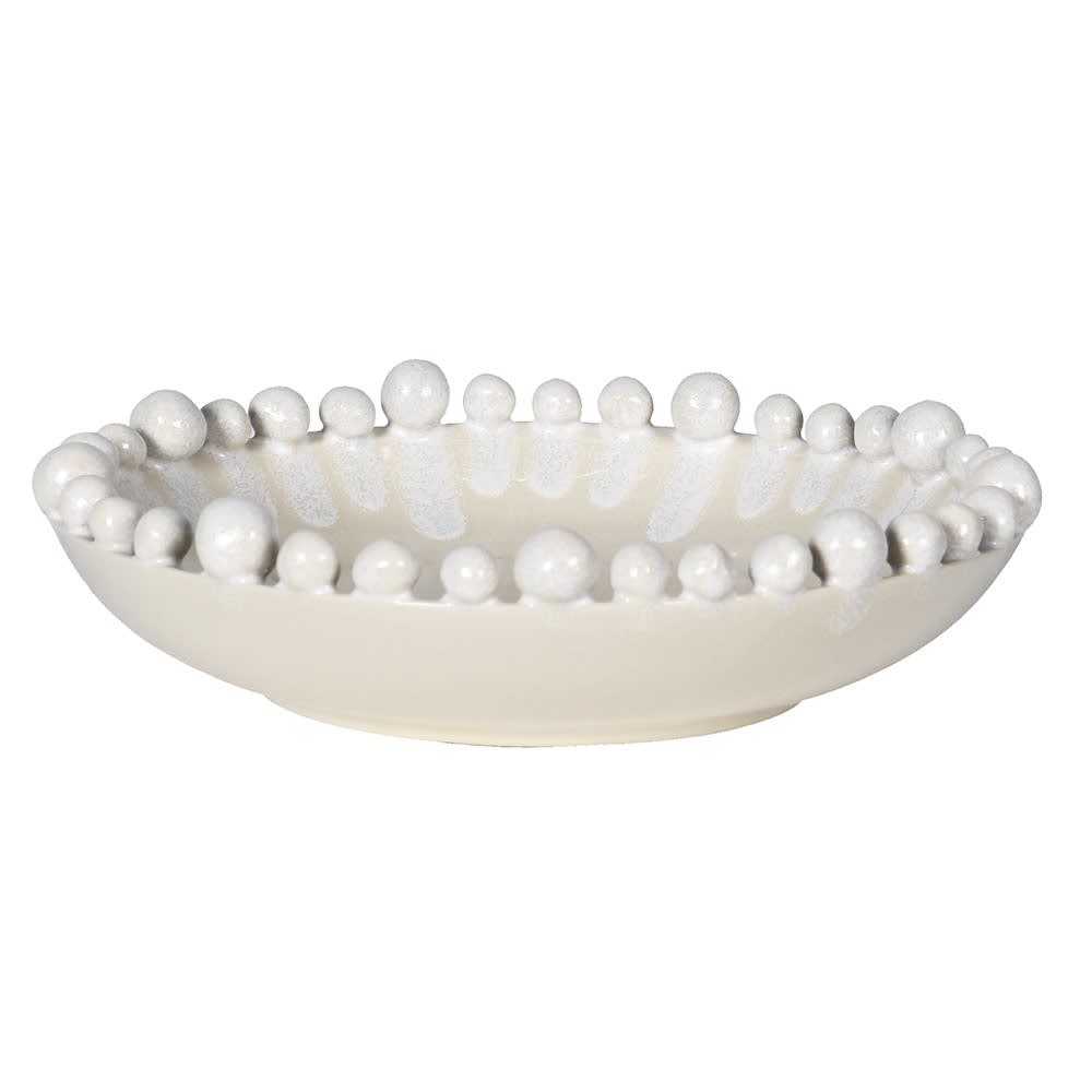 Decorative bowl with bead-like embellishments on a white background