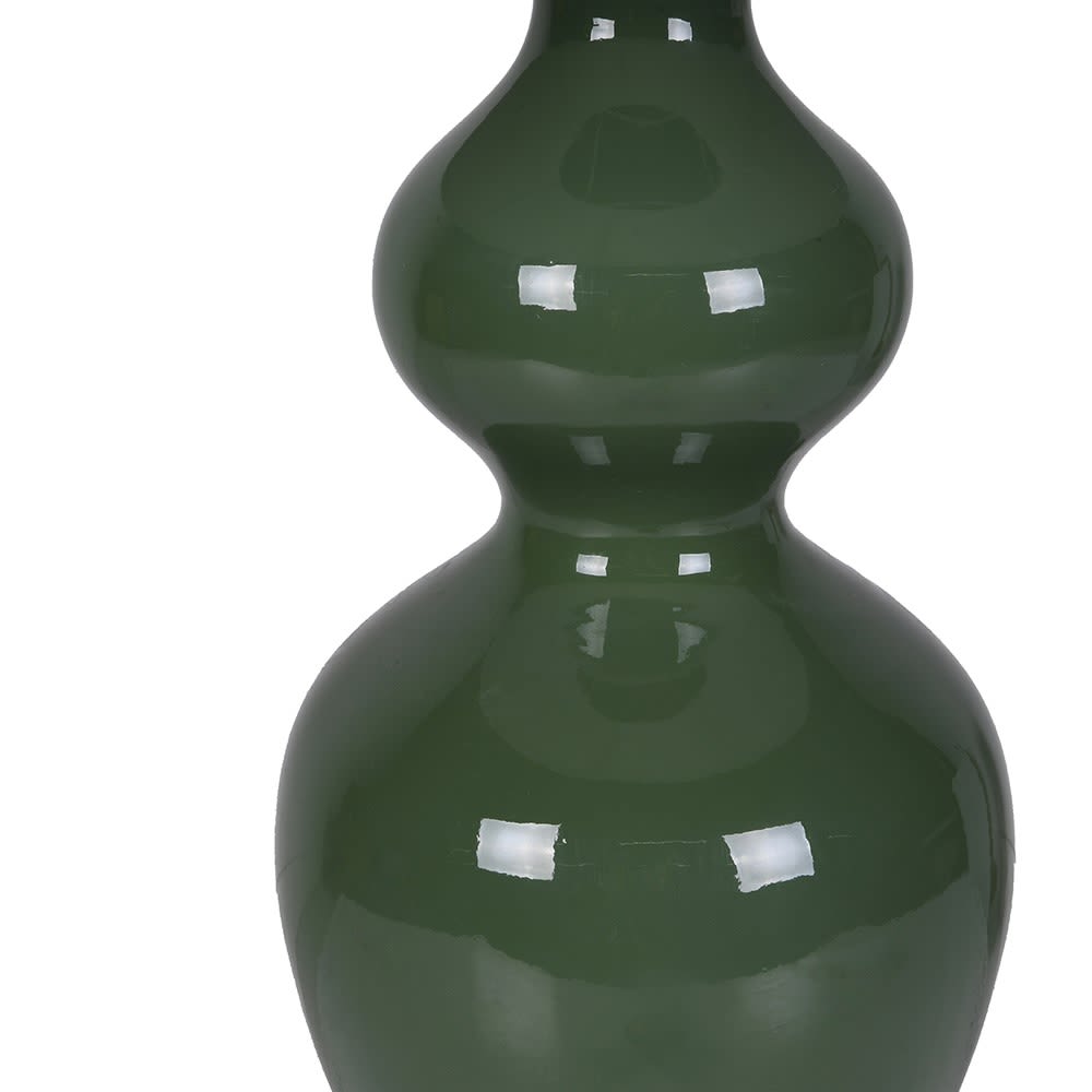Green ceramic vase on a white background