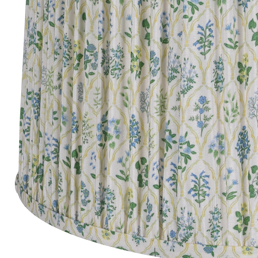 Floral patterned fabric with blue and green flowers on a white background