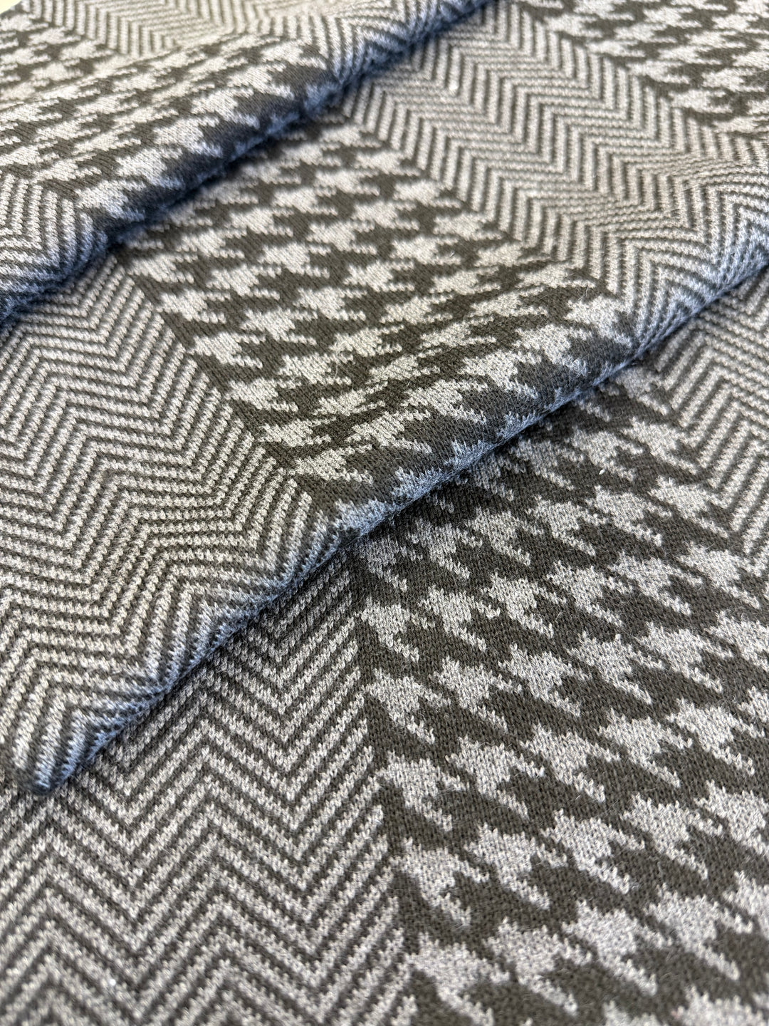 Close-up of gray and black herringbone patterned fabric