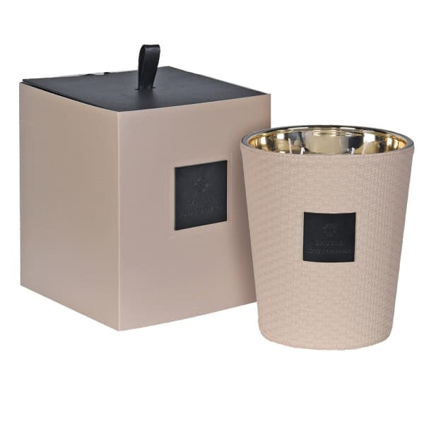 Beige candle with gold interior and matching packaging on a white background