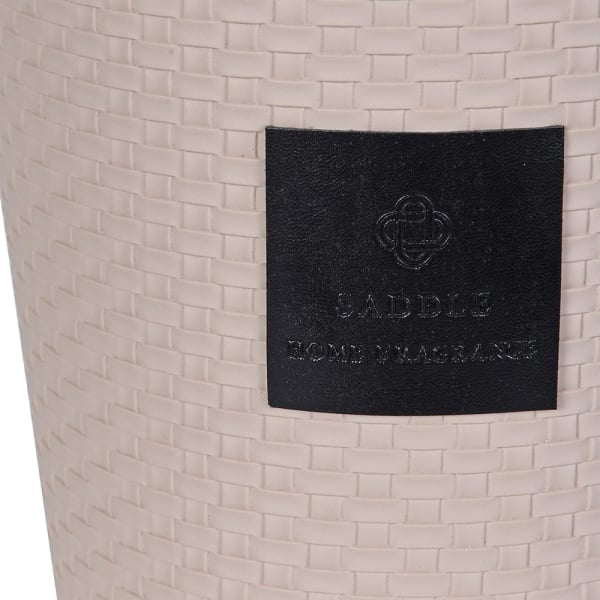 Beige woven product with a black label featuring branding text