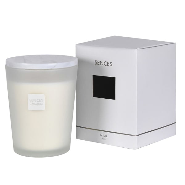 A frosted glass jar candle with white wax next to its white packaging box, both featuring the SENCES brand logo, on a clean white background.