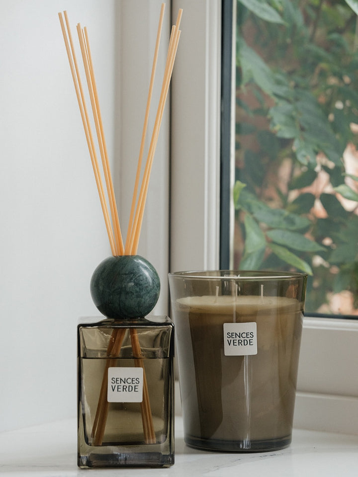  candle in smoky amber glass containers with white labels reading &