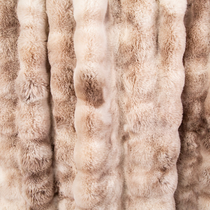 Close-up of beige textured fabric with a ribbed pattern