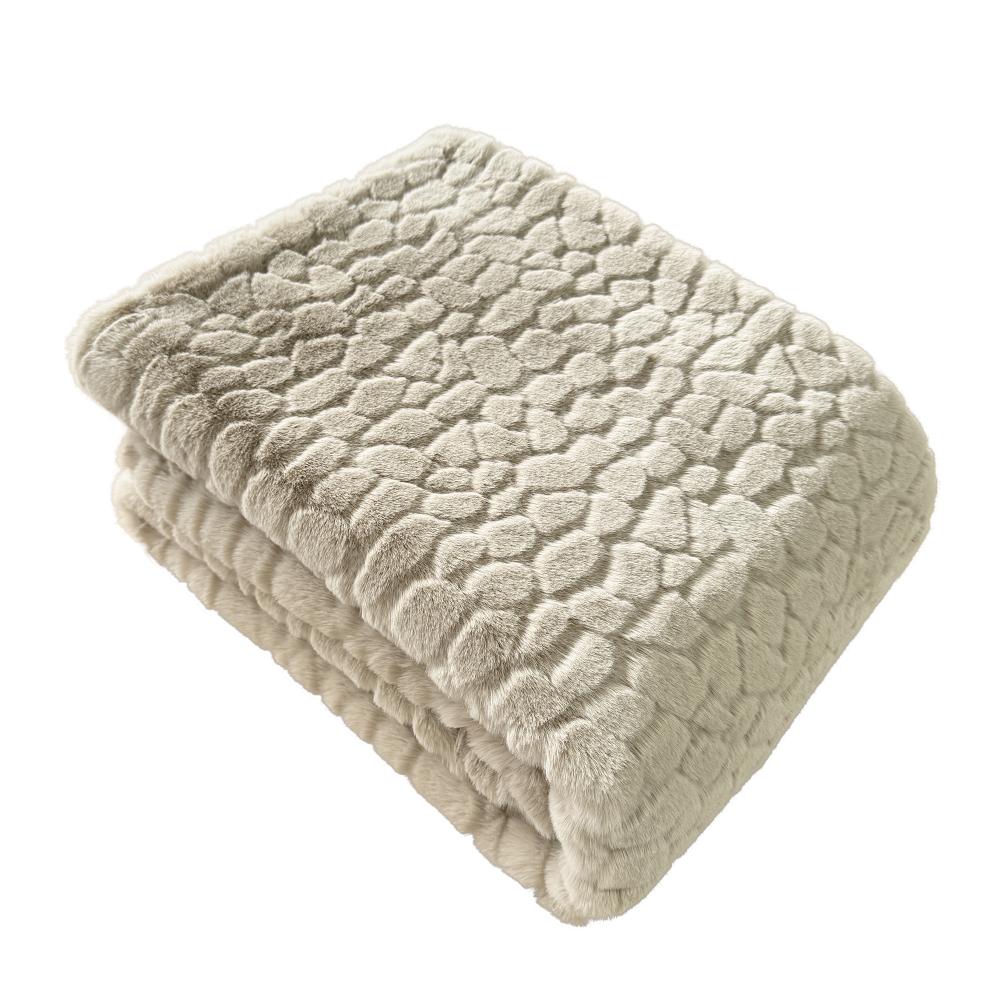 Folded beige textured blanket on a white background