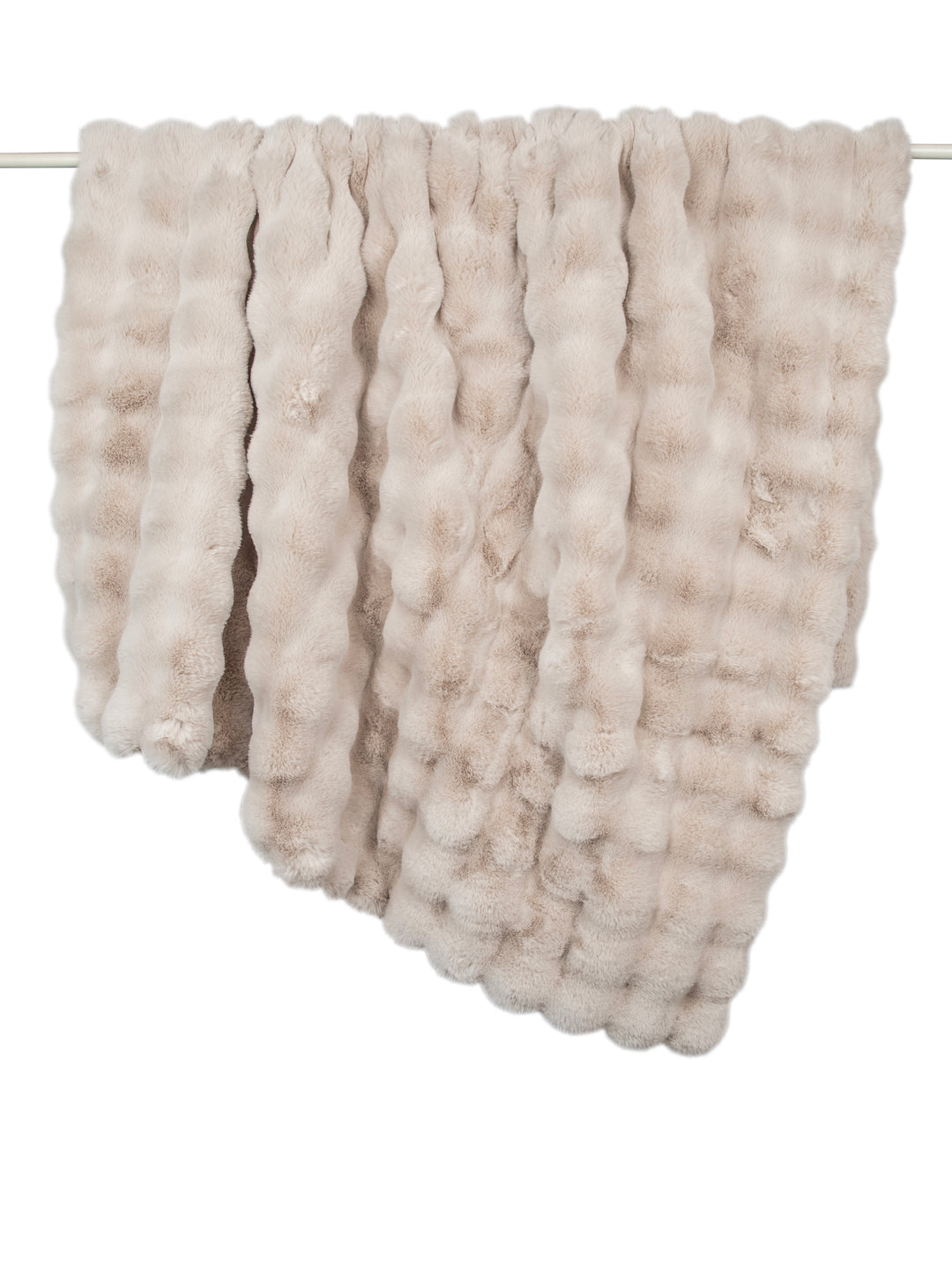 Textured beige blanket draped over a rack on a white background