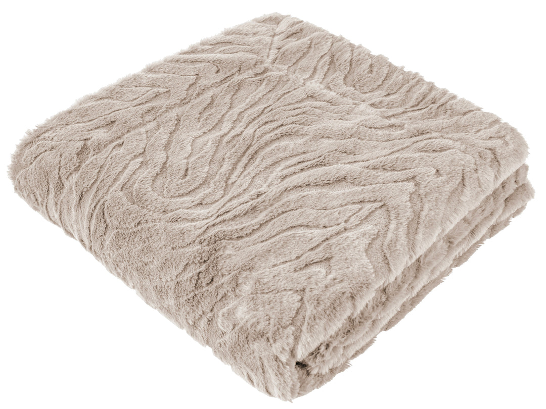 A folded plush throw blanket in a light taupe-beige color, showcasing its textured, wavy knit pattern against a solid white background.