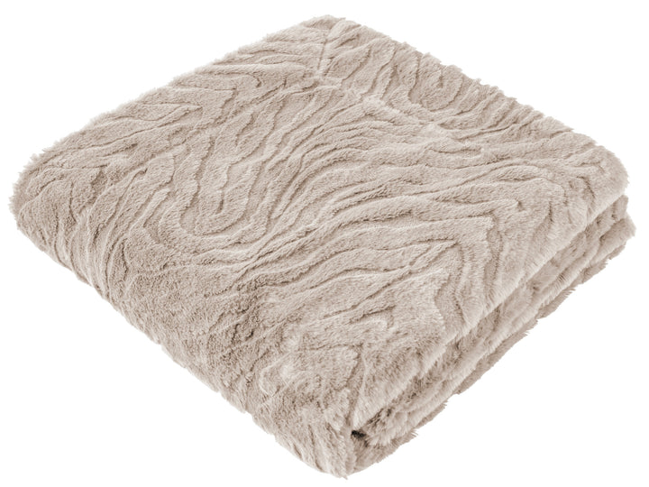 A folded plush throw blanket in a light taupe-beige color, showcasing its textured, wavy knit pattern against a solid white background.