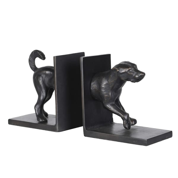 A pair of black metal bookends shaped like dogs, one standing dog and one crouching dog, on a plain white background.