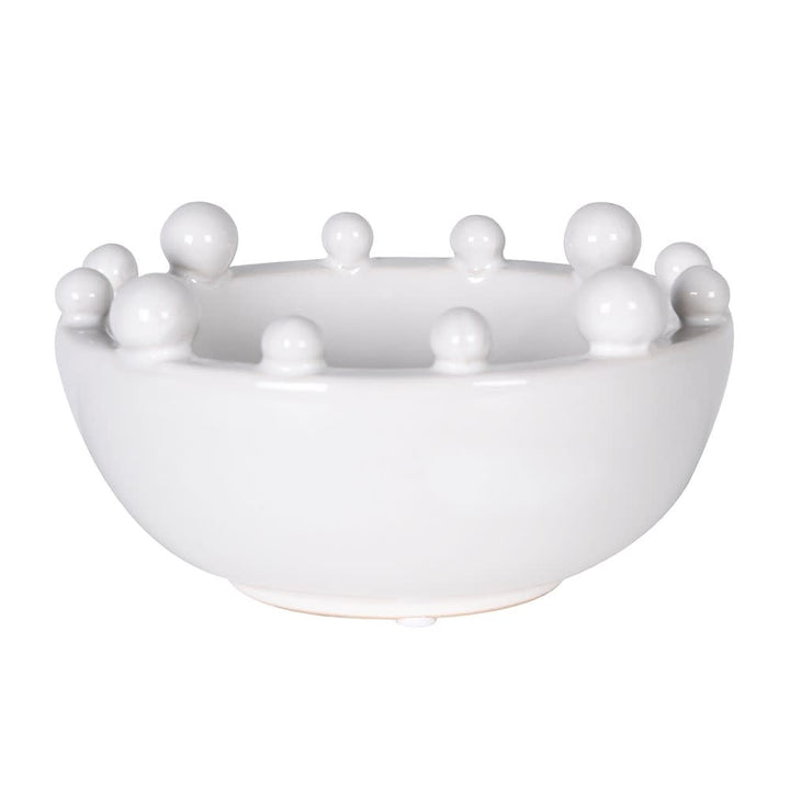 A white ceramic bowl with a raised rim of decorative spherical knobs, photographed on a clean white background.
